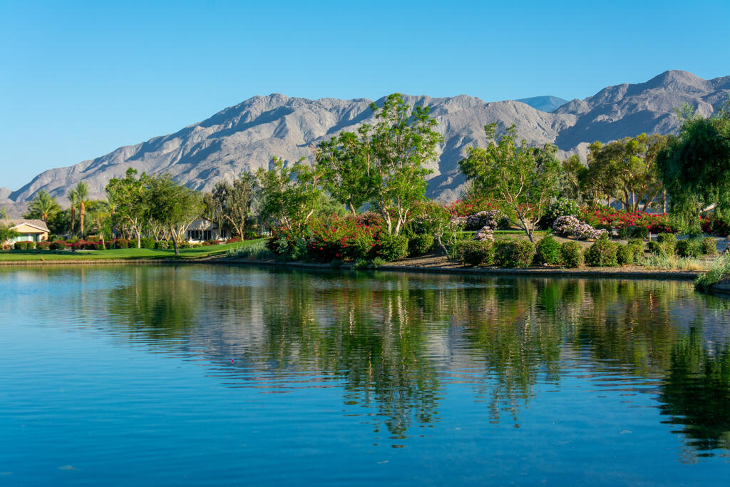 81820 Eagle Claw Drive La Quinta, CA 92253 - Photo 33 of 36 a view of a lake with a mountain in the background