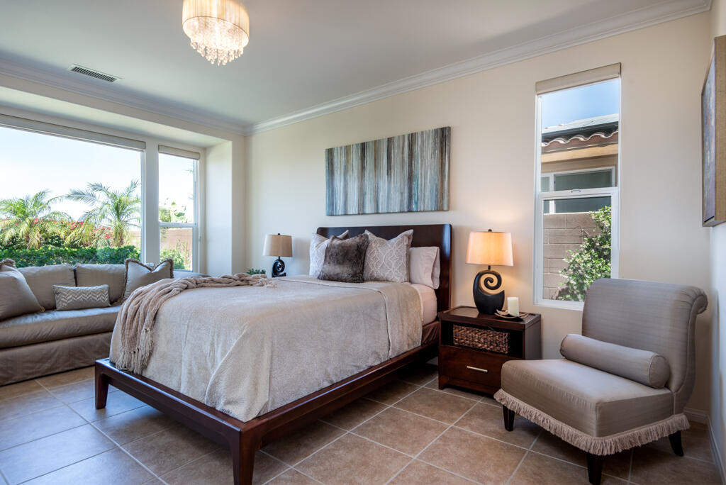 81820 Eagle Claw Drive La Quinta, CA 92253 - Photo 9 of 36 a bedroom with a bed couch and window