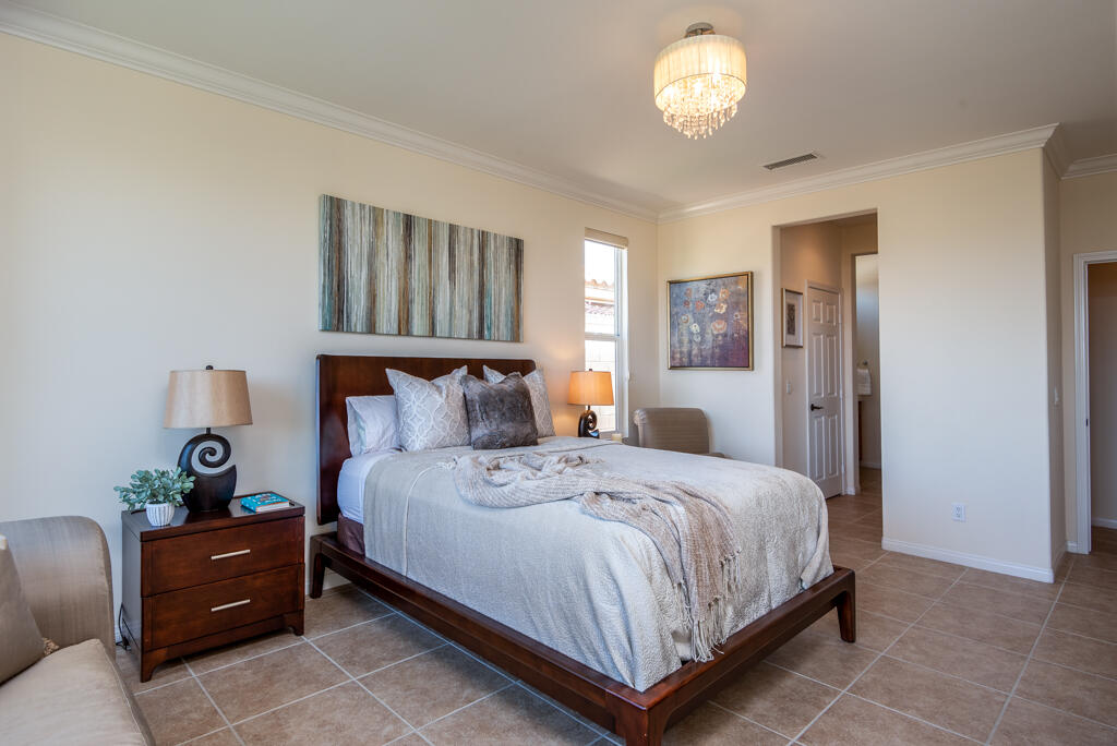 81820 Eagle Claw Drive La Quinta, CA 92253 - Photo 10 of 36 a bedroom with a bed and window
