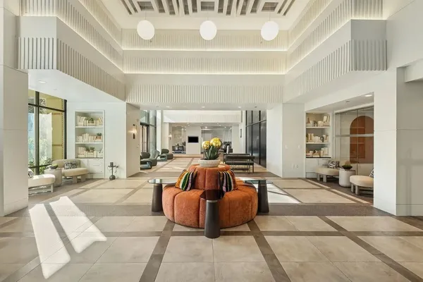 a living room with furniture and a large window