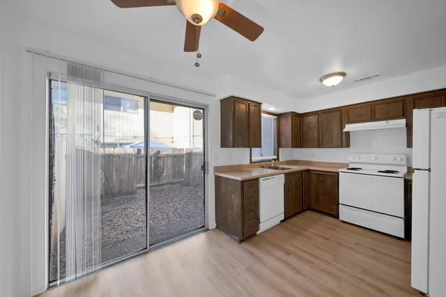 a bedroom with a balcony a large bed and a couch