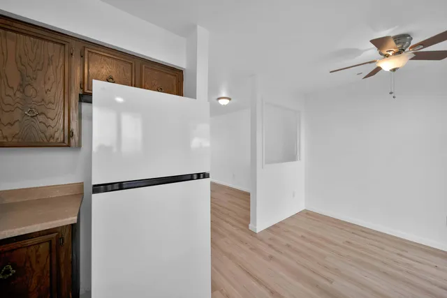a view of a backyard with wooden fence