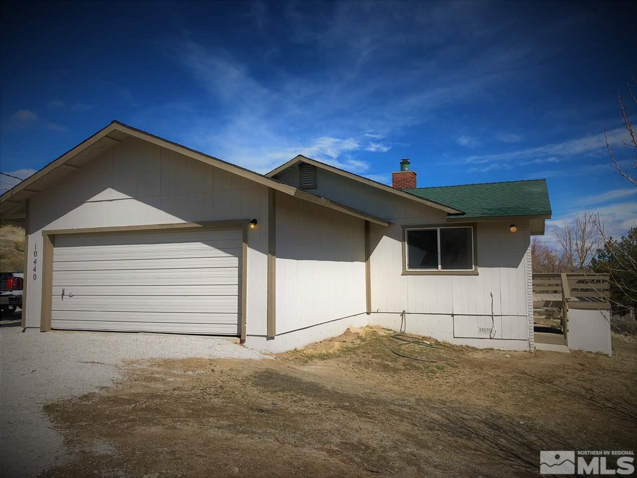 10440 San Fernando Road Reno, NV 89508 - Photo 23 of 24 a front view of a house with a garage