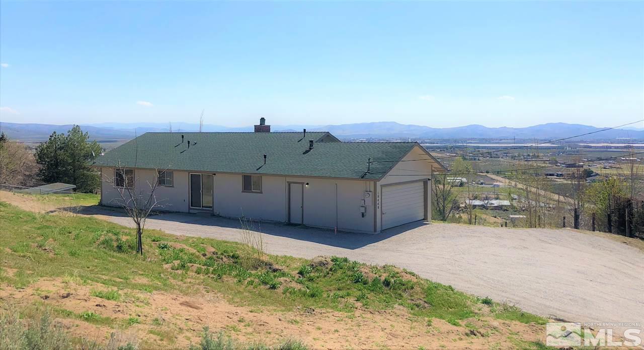 10440 San Fernando Road Reno, NV 89508 - Photo 4 of 24 a view of a house with a yard