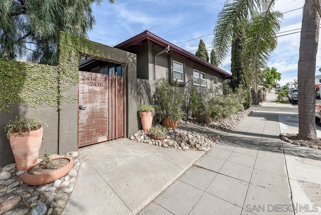 a view of a chairs and table in backyard