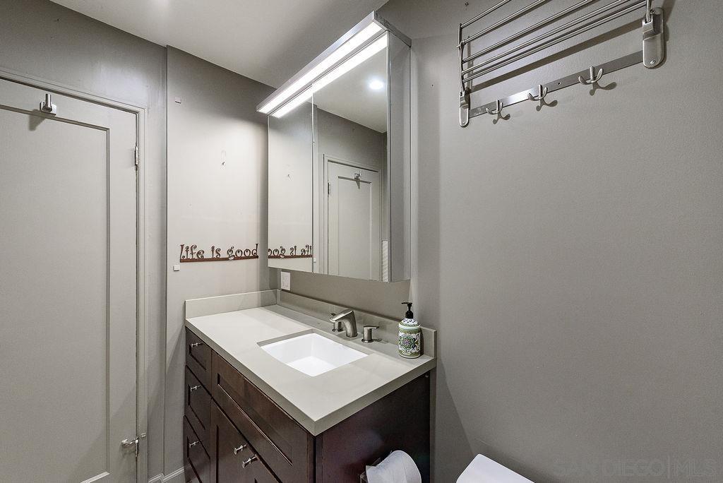 2414 Monroe Avenue San Diego, CA 92116 - Photo 20 of 65 a bathroom with a sink and a mirror