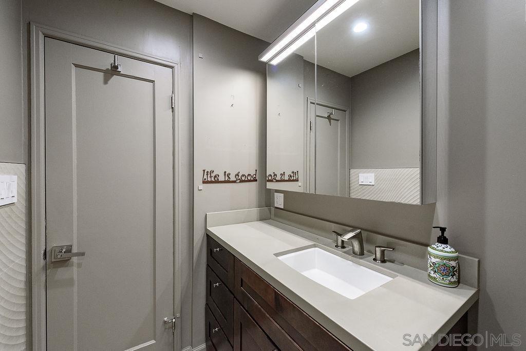 2414 Monroe Avenue San Diego, CA 92116 - Photo 21 of 65 a bathroom with a sink double vanity and a mirror