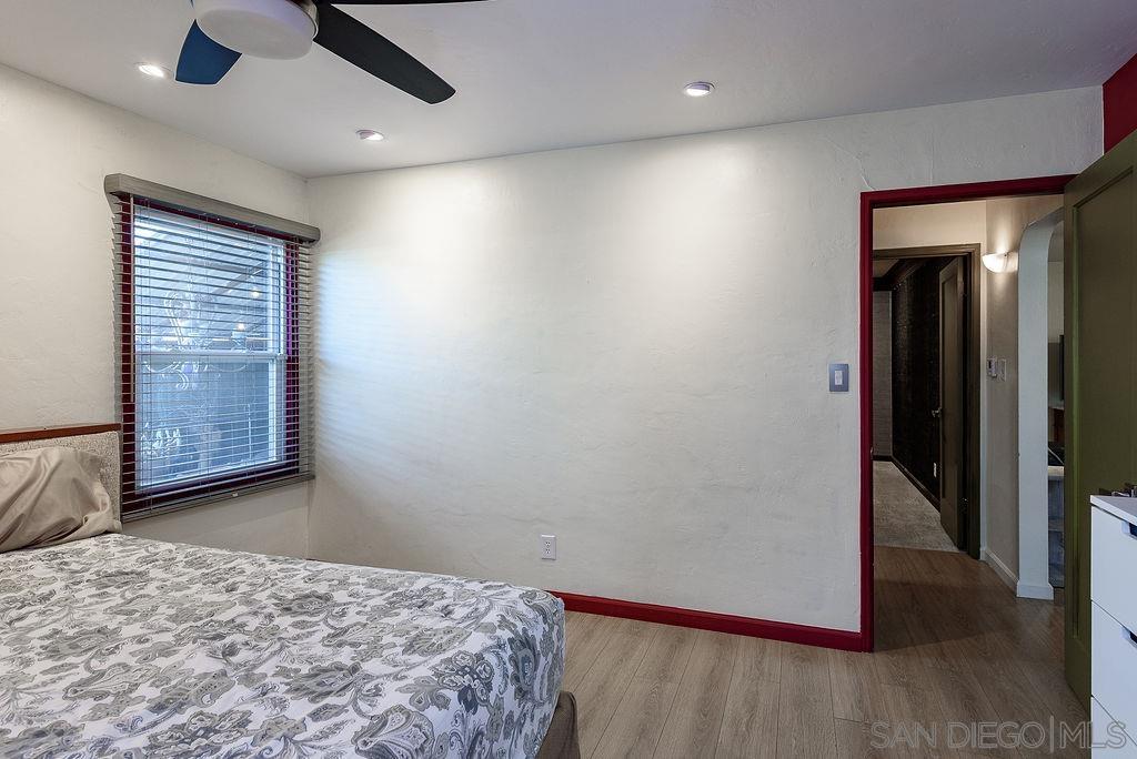 2414 Monroe Avenue San Diego, CA 92116 - Photo 24 of 65 an empty room with wooden floor cabinet and windows