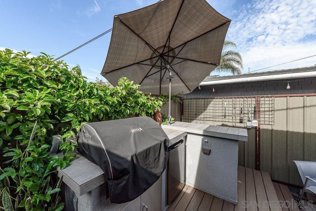 2414 Monroe Avenue San Diego, CA 92116 - Photo 28 of 65 a patio of a house with table and chairs