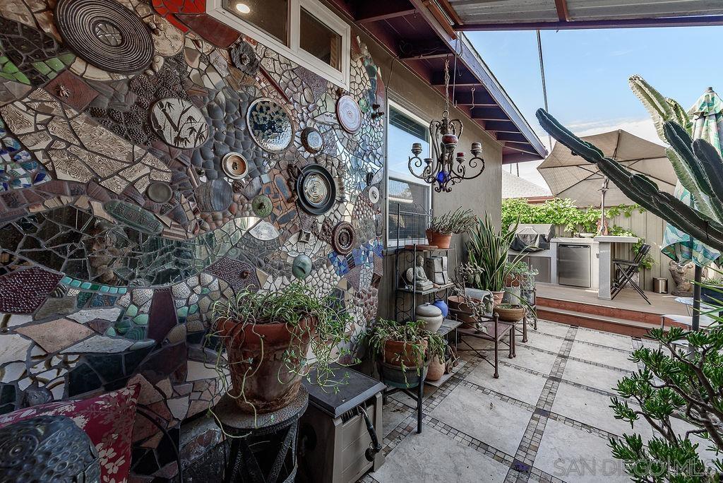 2414 Monroe Avenue San Diego, CA 92116 - Photo 32 of 65 a backyard of a house with outdoor seating