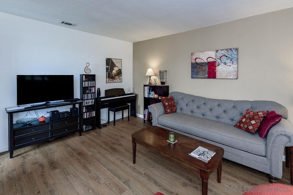 2414 Monroe Avenue San Diego, CA 92116 - Photo 45 of 65 a living room with furniture and a flat screen tv