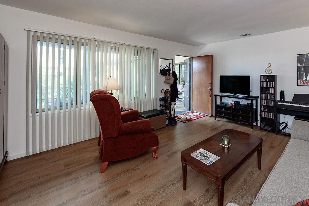 2414 Monroe Avenue San Diego, CA 92116 - Photo 48 of 65 a living room with furniture and a flat screen tv