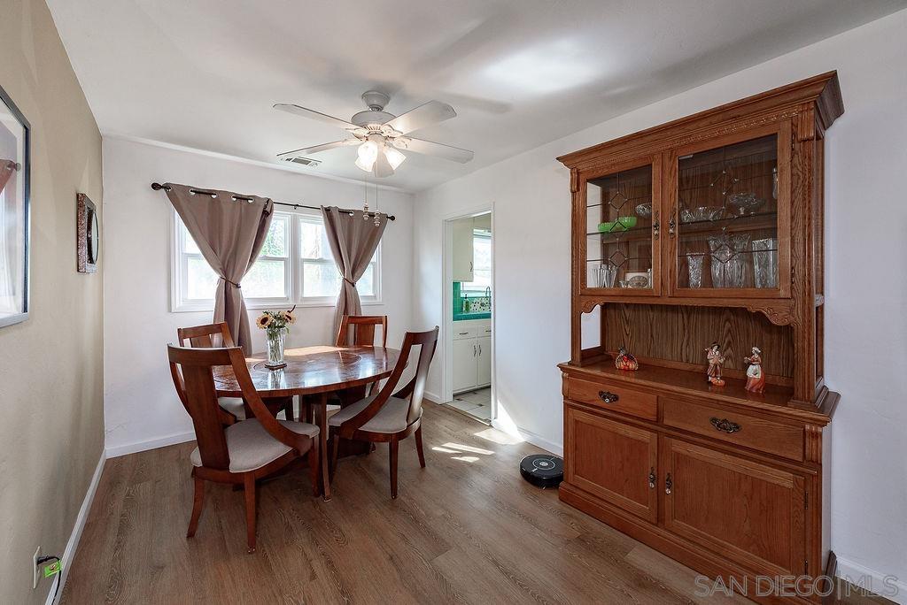 2414 Monroe Avenue San Diego, CA 92116 - Photo 50 of 65 a view of a dining room with furniture window and wooden floor