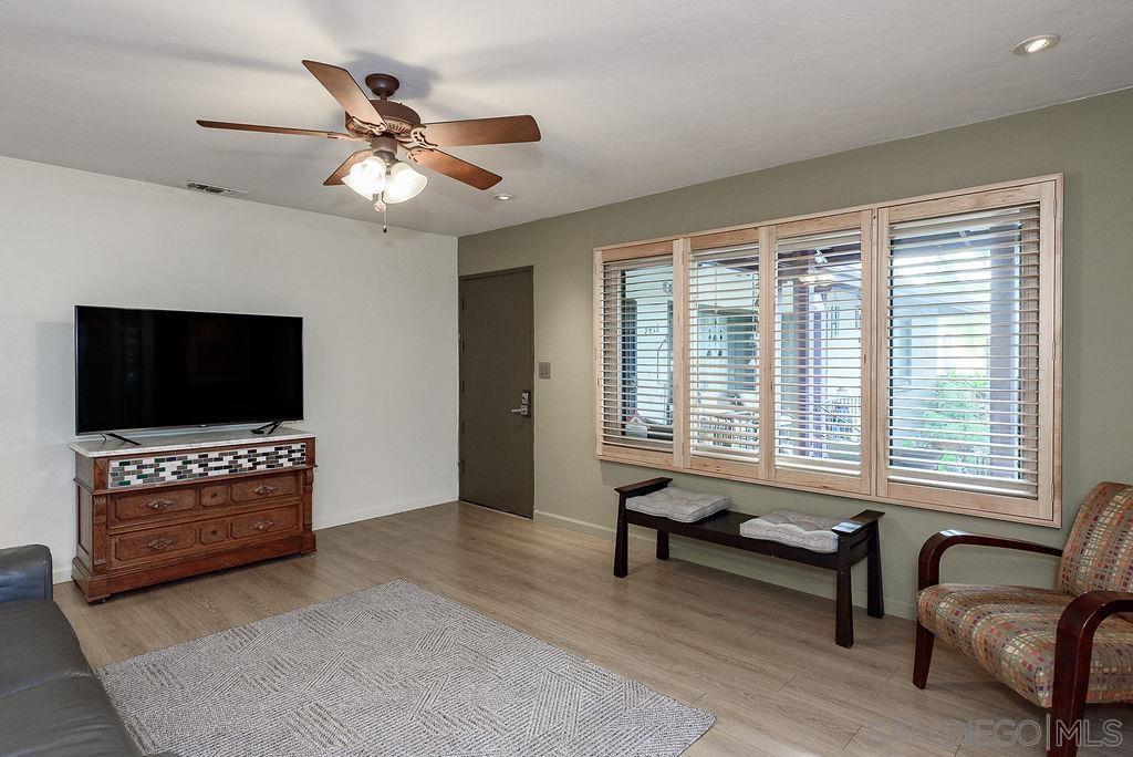 2414 Monroe Avenue San Diego, CA 92116 - Photo 5 of 65 a living room with furniture and a flat screen tv