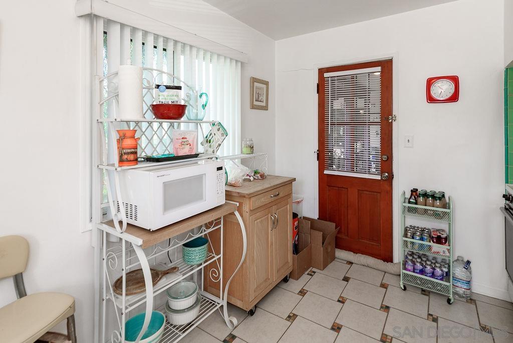 2414 Monroe Avenue San Diego, CA 92116 - Photo 53 of 65 a utility room with cabinets a washer and dryer