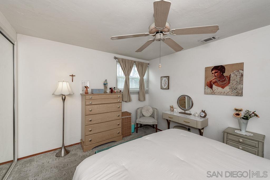 2414 Monroe Avenue San Diego, CA 92116 - Photo 54 of 65 a bedroom with a bed and furniture