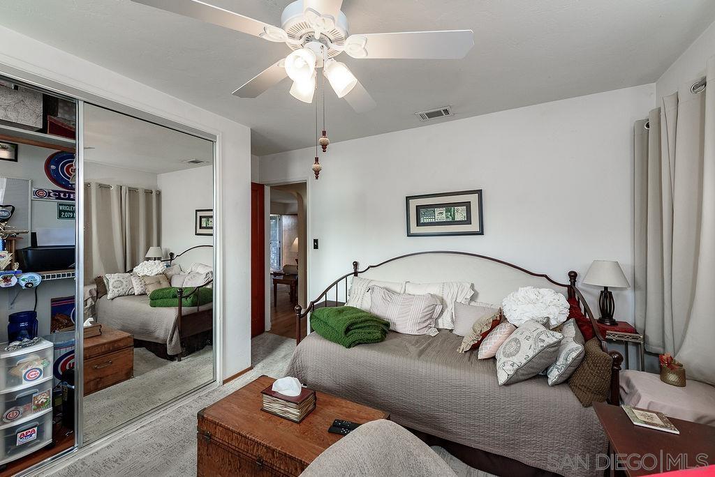 2414 Monroe Avenue San Diego, CA 92116 - Photo 56 of 65 a living room with furniture and a chandelier