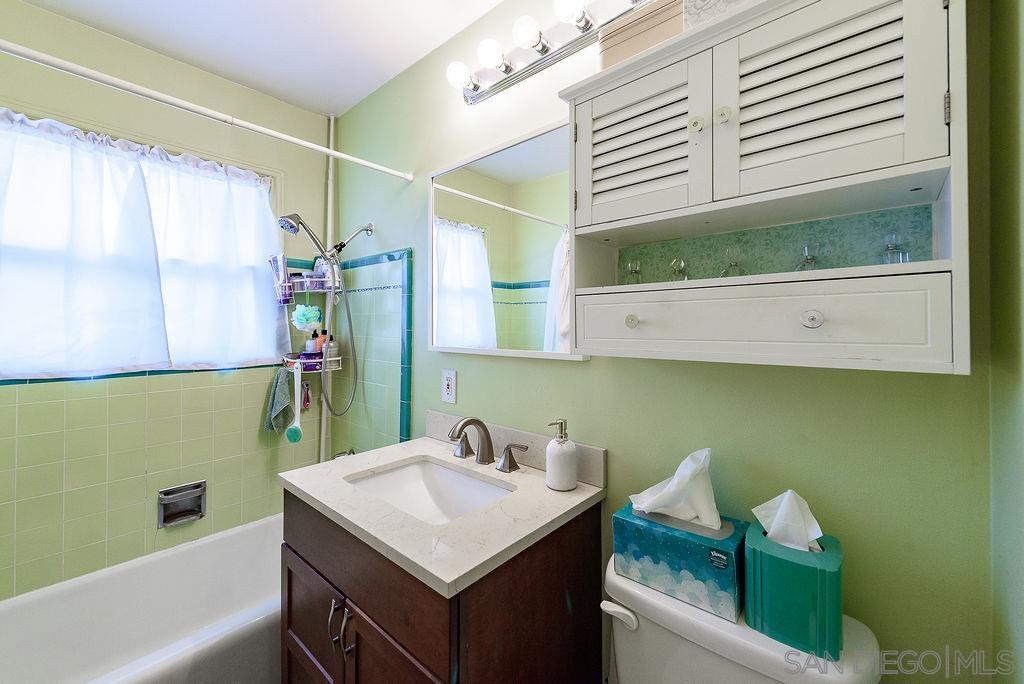 2414 Monroe Avenue San Diego, CA 92116 - Photo 58 of 65 a bathroom with a sink and a mirror