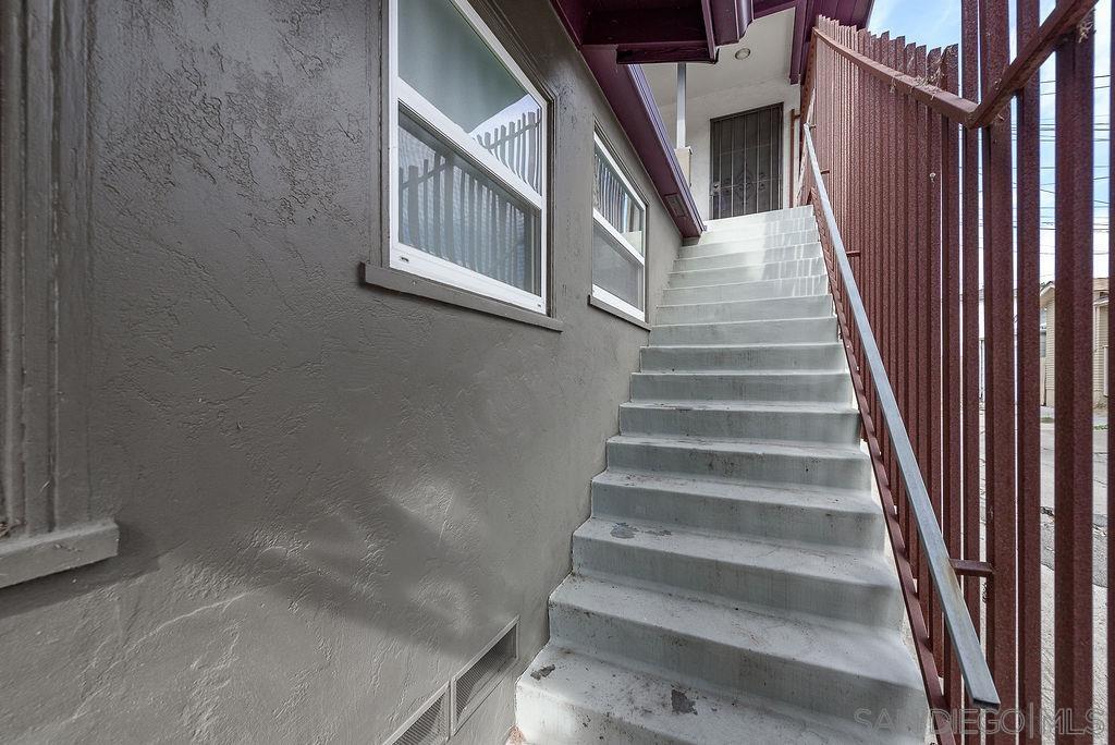 2414 Monroe Avenue San Diego, CA 92116 - Photo 61 of 65 a view of staircase with white walls and windows