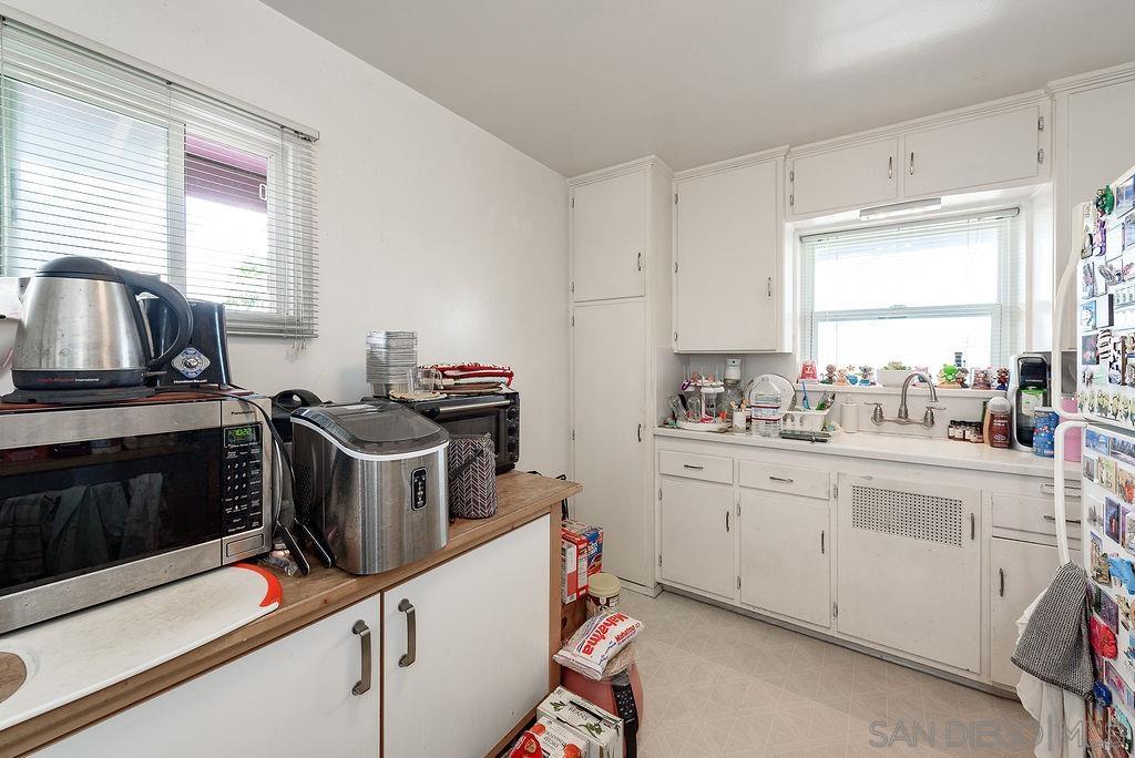 2414 Monroe Avenue San Diego, CA 92116 - Photo 63 of 65 a kitchen with appliances a sink and a stove