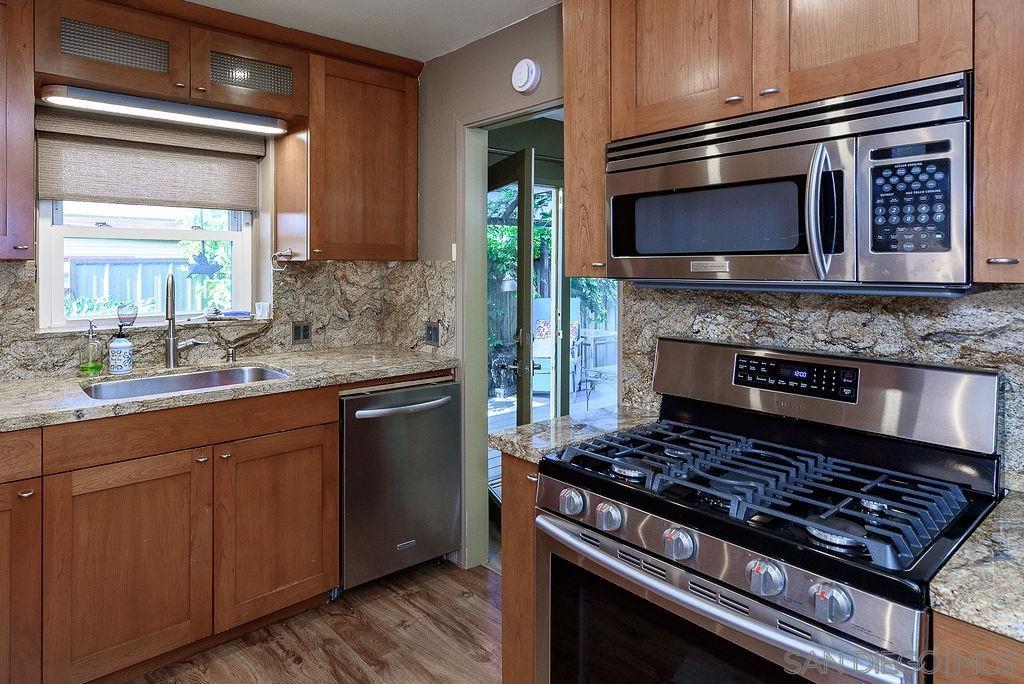 2414 Monroe Avenue San Diego, CA 92116 - Photo 9 of 65 a kitchen with a stove and a microwave