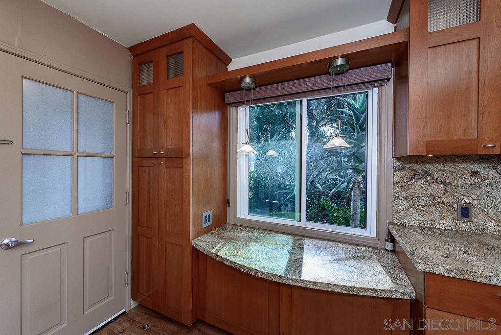 2414 Monroe Avenue San Diego, CA 92116 - Photo 10 of 65 a bathroom with a granite countertop sink and large window