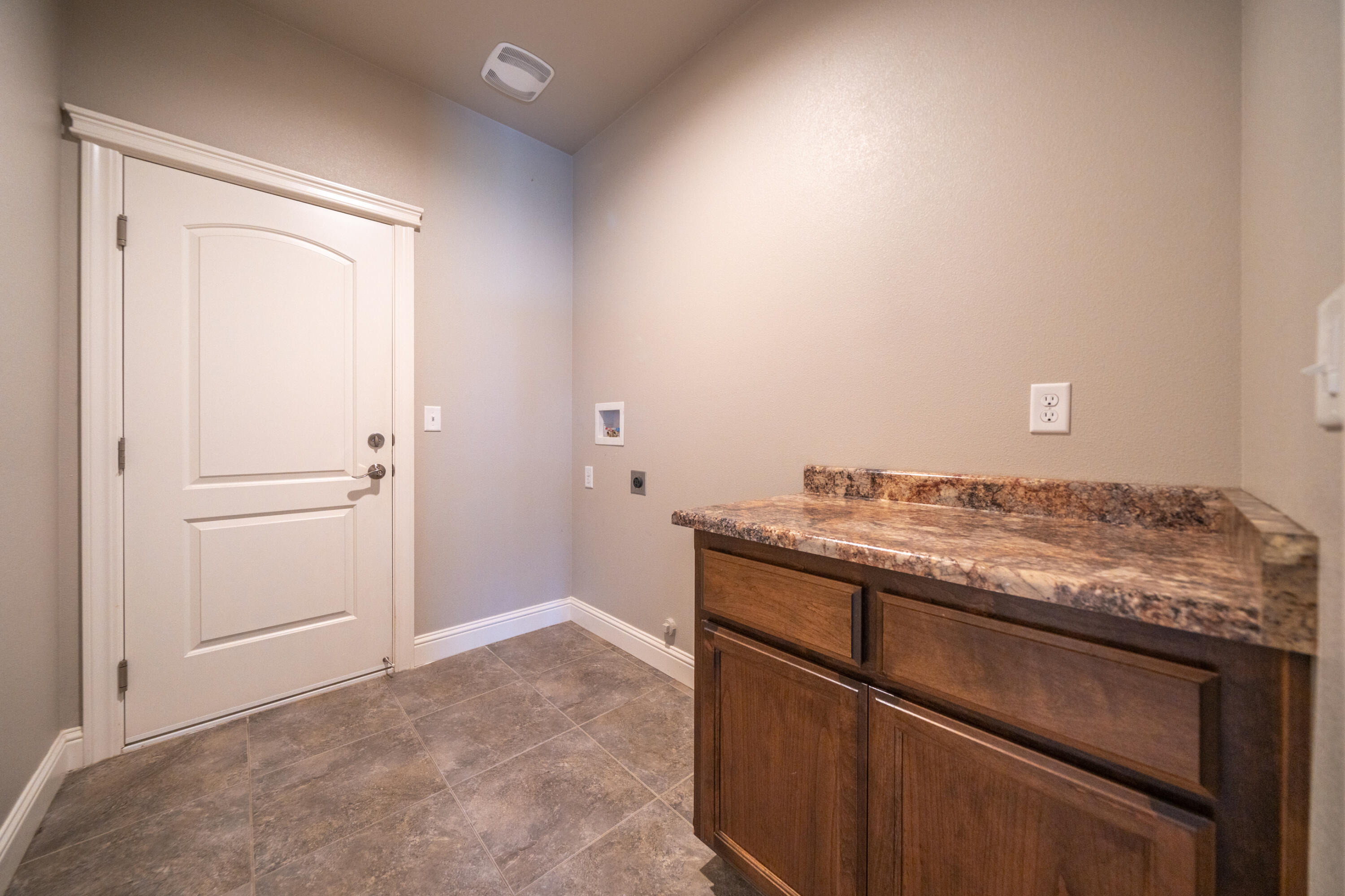 5571 Muir Peak Road Redding, CA 96002 - Photo 31 of 42 a room with a stove and a sink