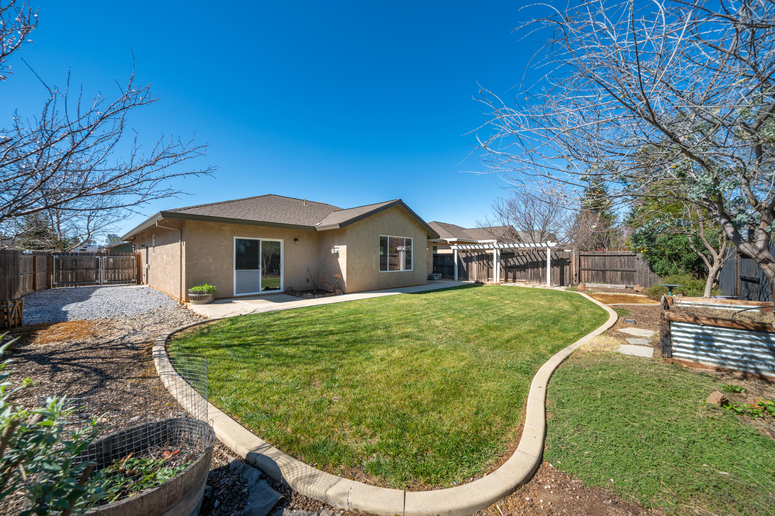 5571 Muir Peak Road Redding, CA 96002 - Photo 39 of 42 a view of a house with a yard