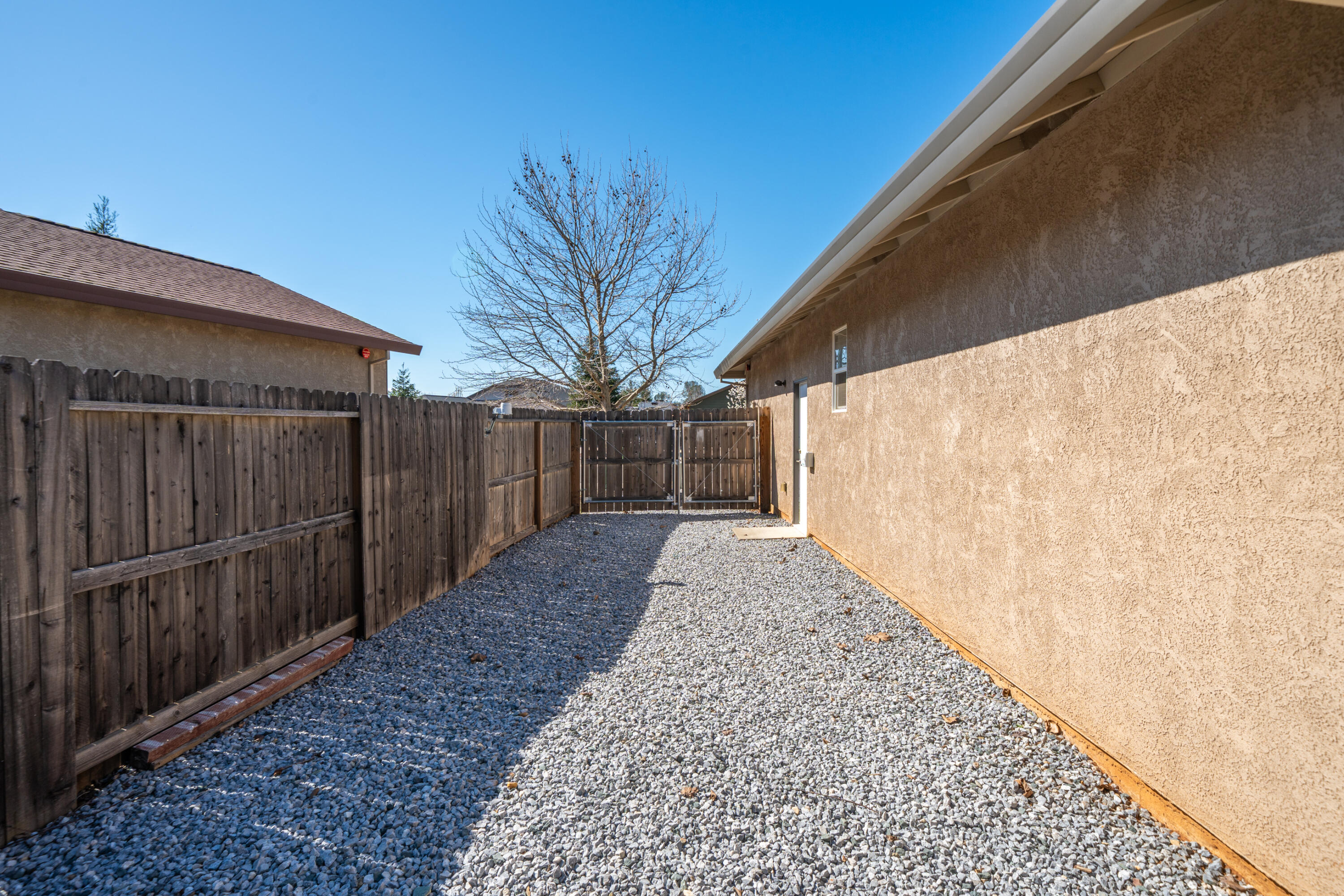 5571 Muir Peak Road Redding, CA 96002 - Photo 42 of 42 a view of a backyard with wooden fence