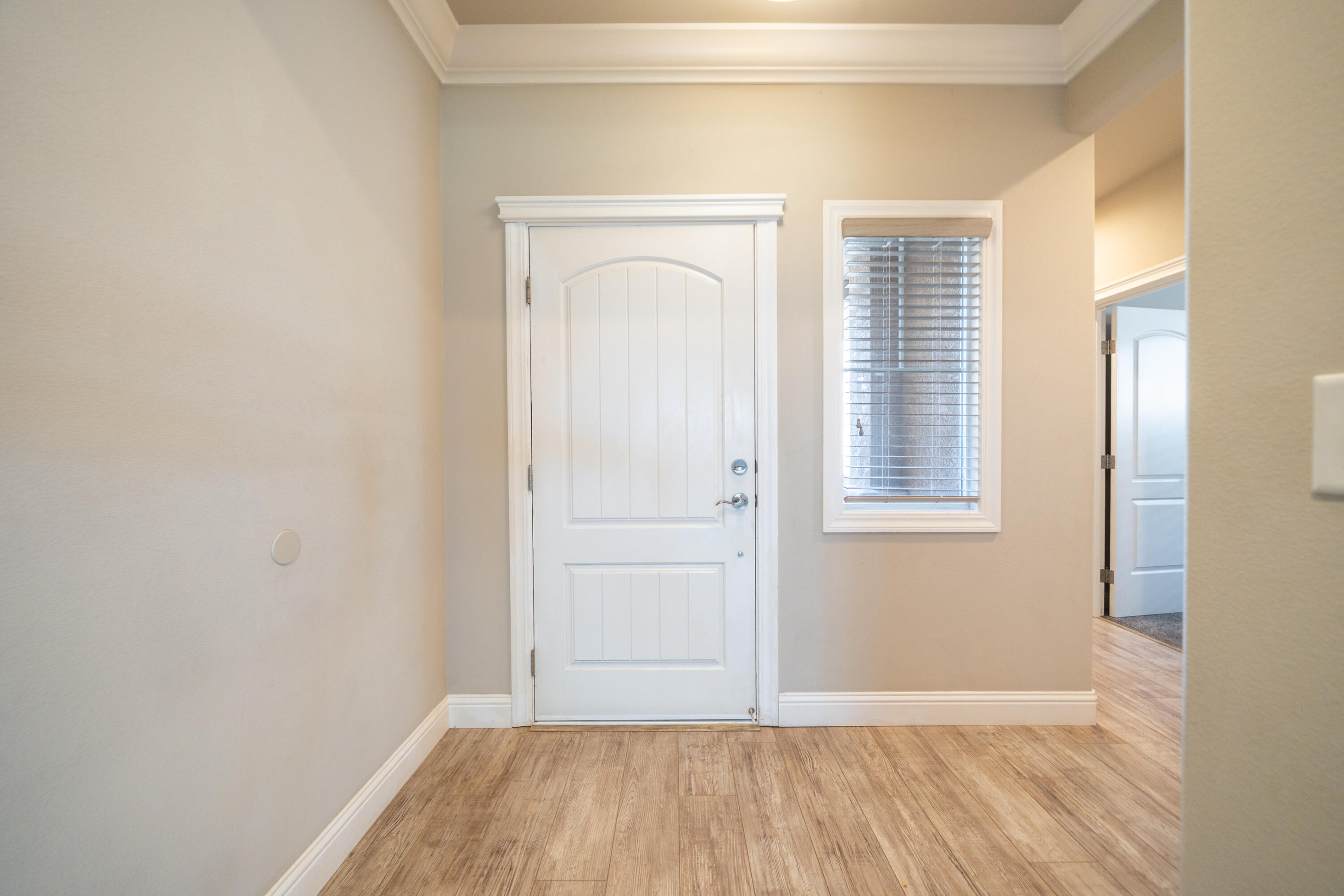 5571 Muir Peak Road Redding, CA 96002 - Photo 9 of 42 an empty room with wooden floor and windows