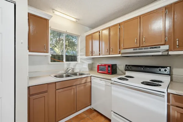 a kitchen with a sink and a window