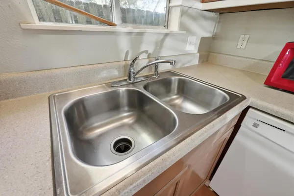 a kitchen with a stove and a microwave