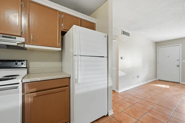 a room with a bench and a window