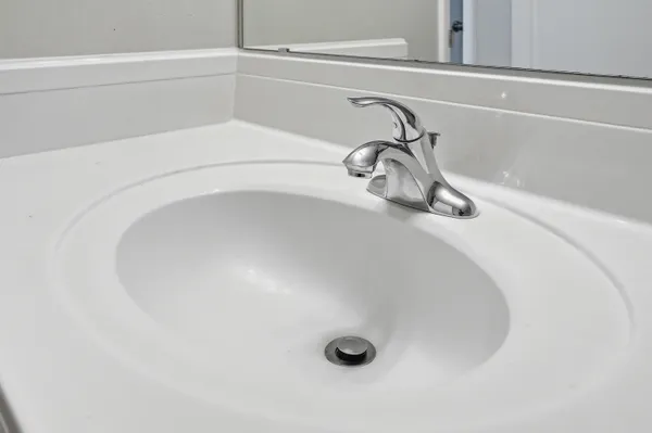 a bathroom with a bath tub with a shower