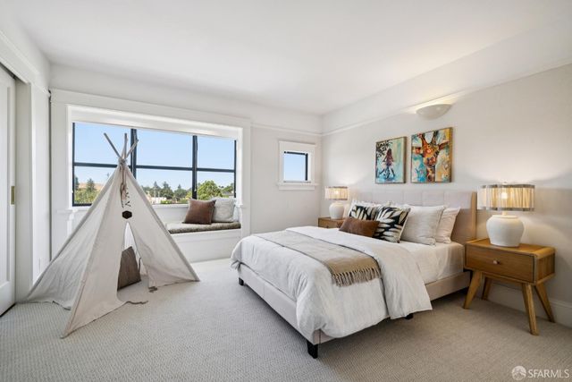 a bed room with a bed and a couch