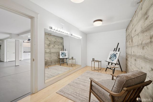 a dining room with furniture and wooden floor