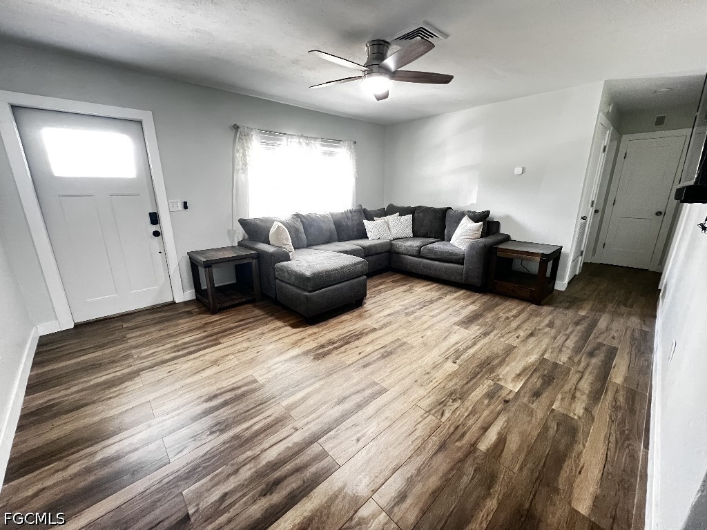 144 Whidden Road North Fort Myers, FL 33917 - Photo 6 of 16 a living room with furniture and a chandelier