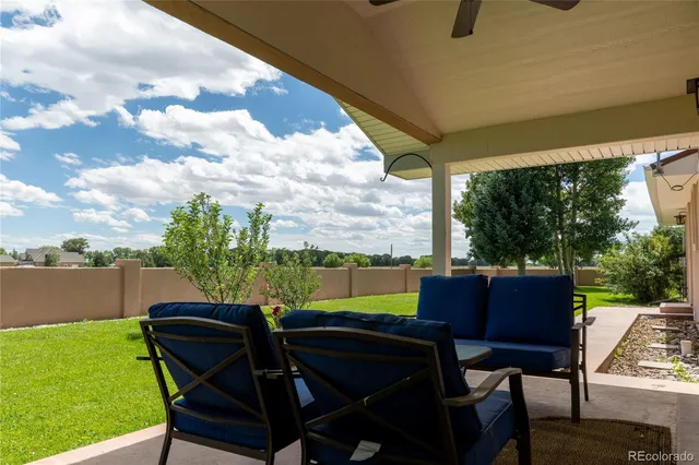a view of balcony with furniture