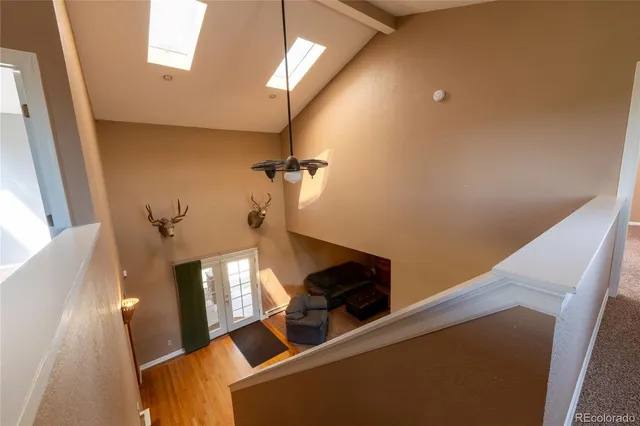 a view of a room with wooden floor