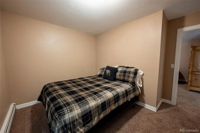 a bedroom with a bed and a table