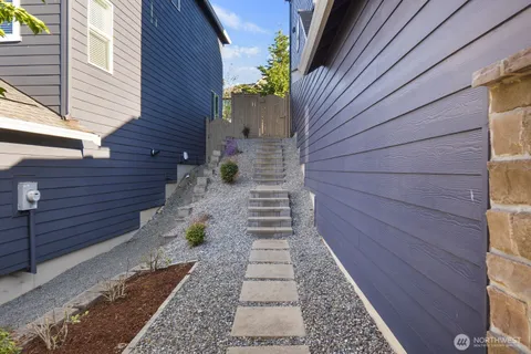 a view of a pathway with a backyard