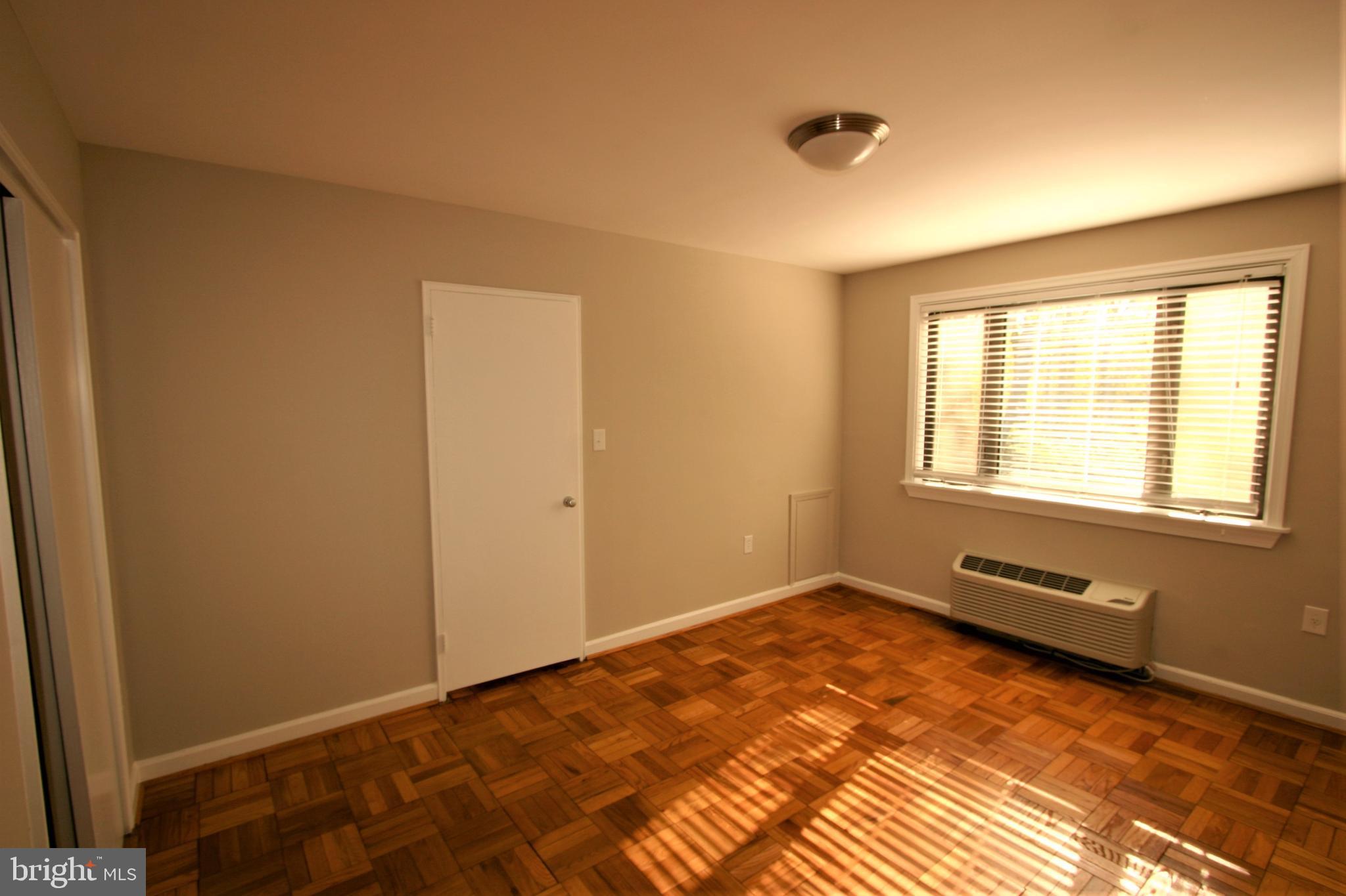 4114 Davis Place Northwest, Unit 210 Washington, DC 20007 - Photo 15 of 22 Bedroom View 3 - shows Heater/Cooler Wall Unit