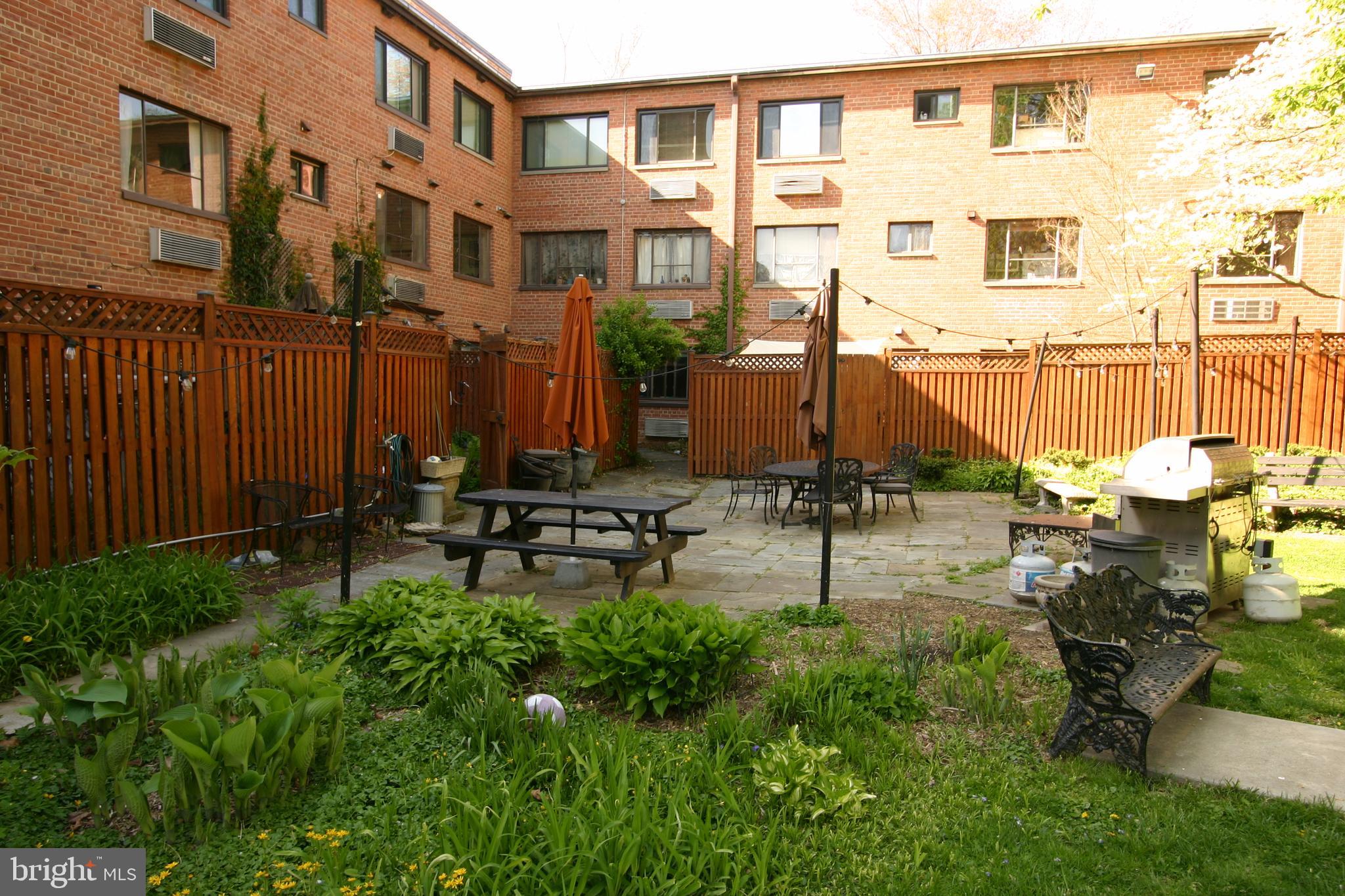 4114 Davis Place Northwest, Unit 210 Washington, DC 20007 - Photo 20 of 22 Back Yard Patio, Grills & Tables for Residents'