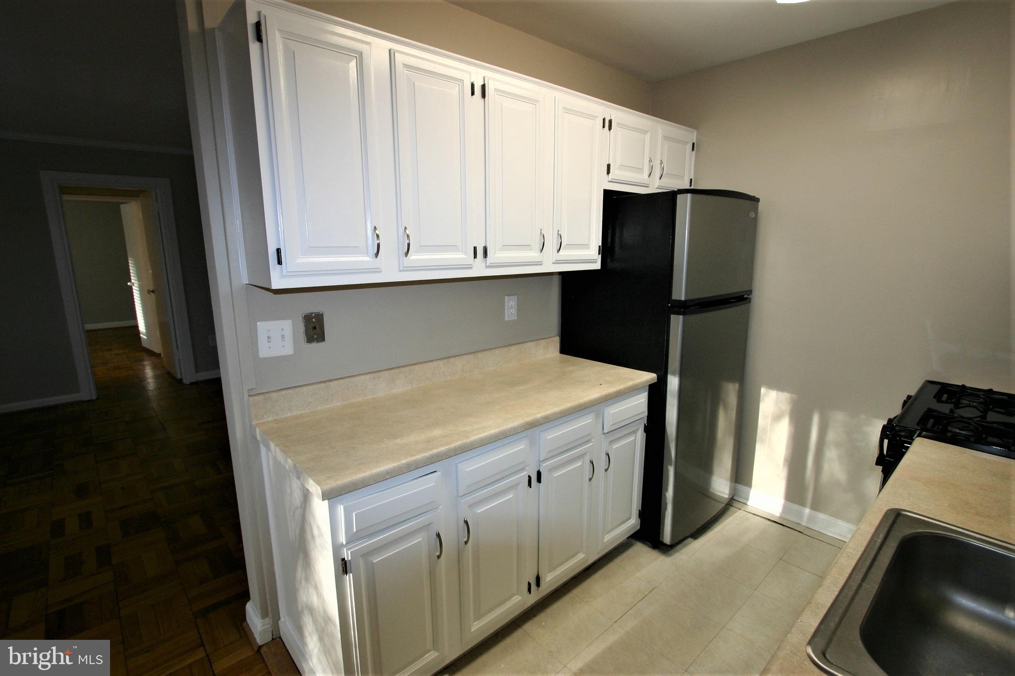 4114 Davis Place Northwest, Unit 210 Washington, DC 20007 - Photo 10 of 22 Kitchen Cabinets 2