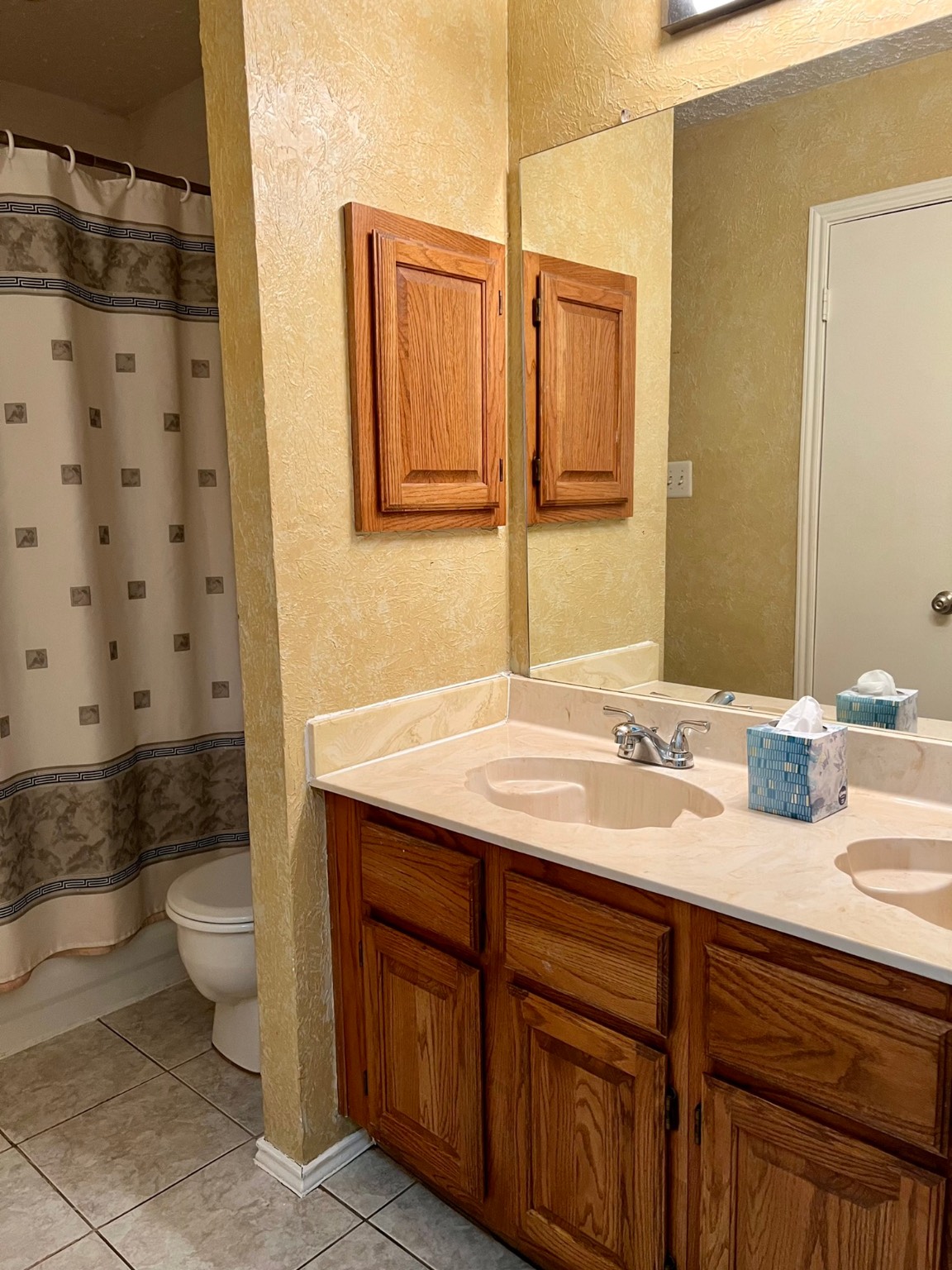 3702 Echo Grove Lane Houston, TX 77043 - Photo 13 of 18 a bathroom with a granite countertop sink toilet and shower