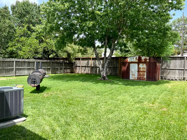 a view of a backyard with a garden