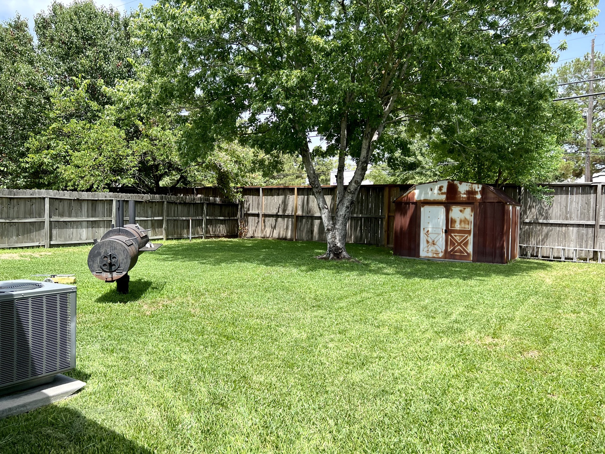 3702 Echo Grove Lane Houston, TX 77043 - Photo 17 of 18 a view of a backyard with a garden