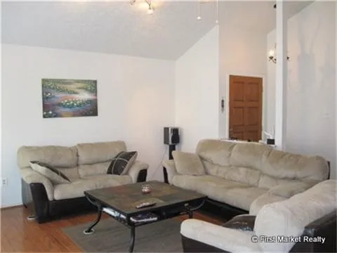 a living room with furniture and a couch