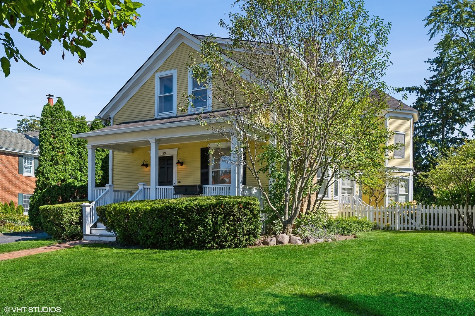 a front view of a house with a garden