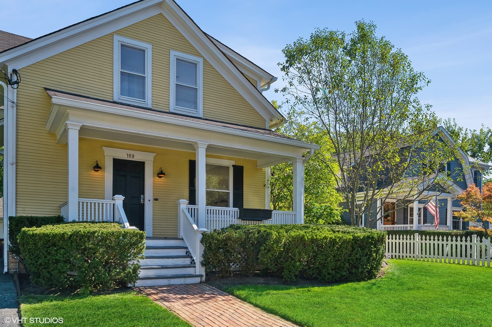 189 Ridge Avenue Winnetka, IL 60093 - Photo 2 of 4 a front view of a house with a yard